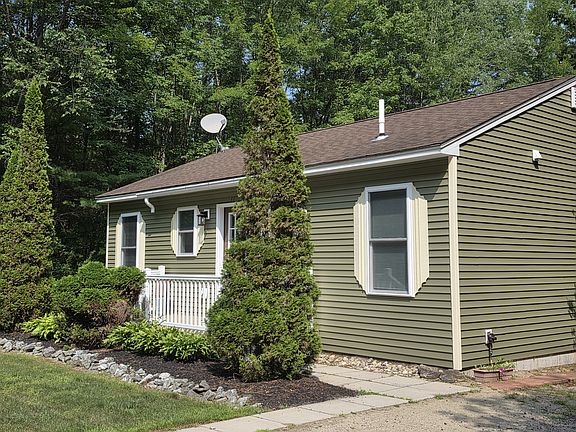 Side view of front from 2-car driveway.