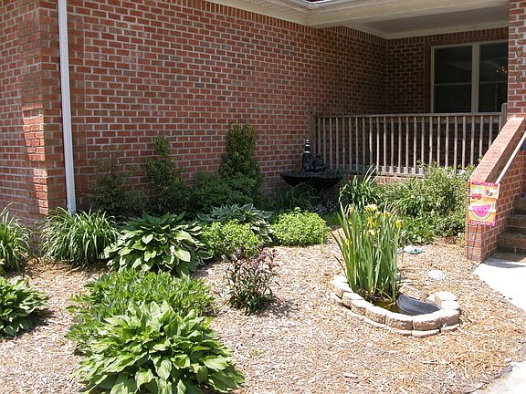 garden entrance with pond