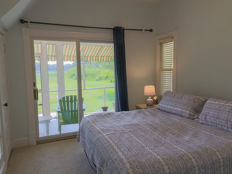 Primary suite with access to screened in porch
