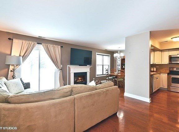 Living Room opens to Dining Room & Kitchen