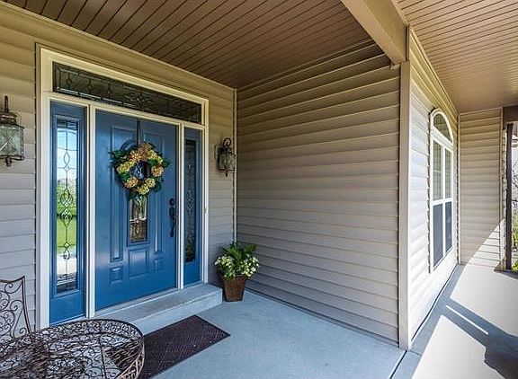 Wonderfully convenient vinyl and brick siding wrap this amazing home.