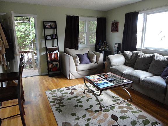 Living room with an access to the front porch/yard