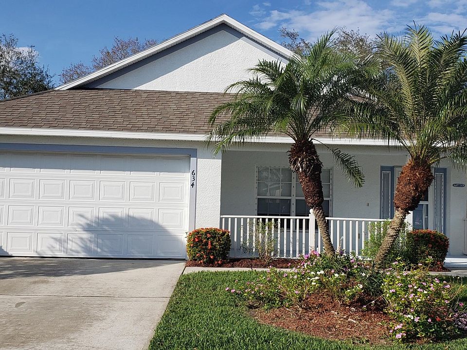 FRONT OF HOME WITH COZY FRONT PORCH