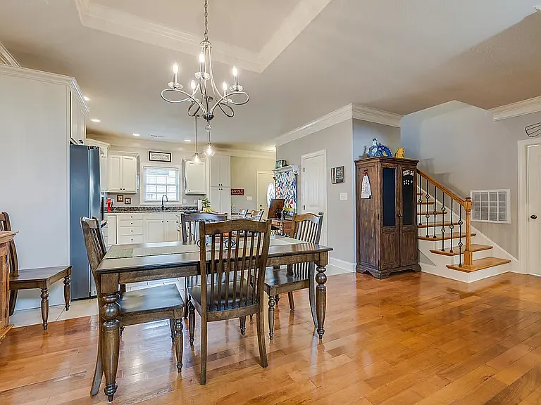 Dining Room with Tray Ceiling and Kitchen