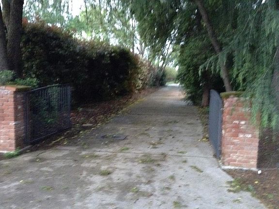 Private driveway and park next to apartment