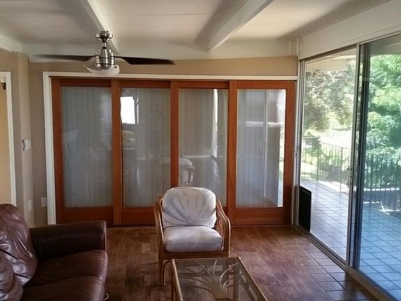 Living area photo of bedroom #2 with sliding doors closed