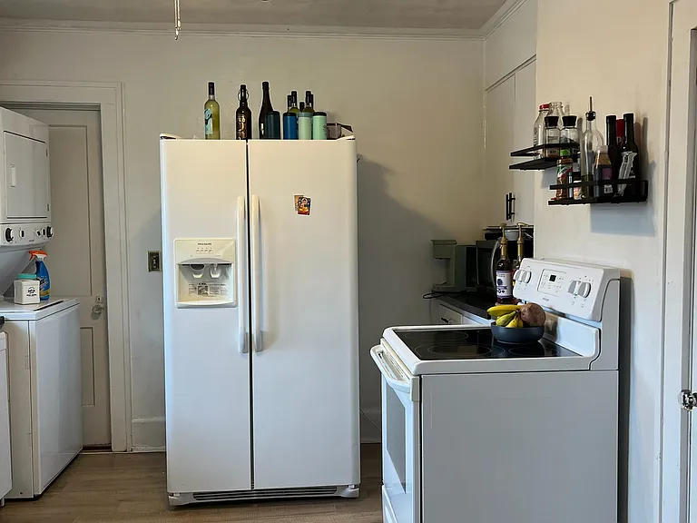 Kitchen w/ Side by Side Refrigerator w/ Ice maker, Stackable Washer/Dryer, Dishwasher and Flat Surface Stove. New Designer Ceiling Fan!