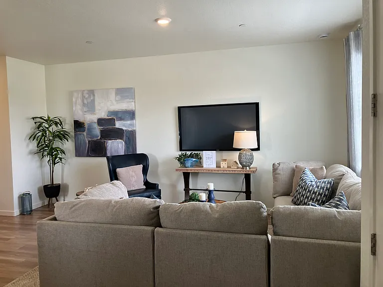 Sample of same floor plan, different finishes, staged with furniture.