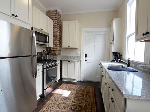 Full Kitchen and second entrance to the parking area.