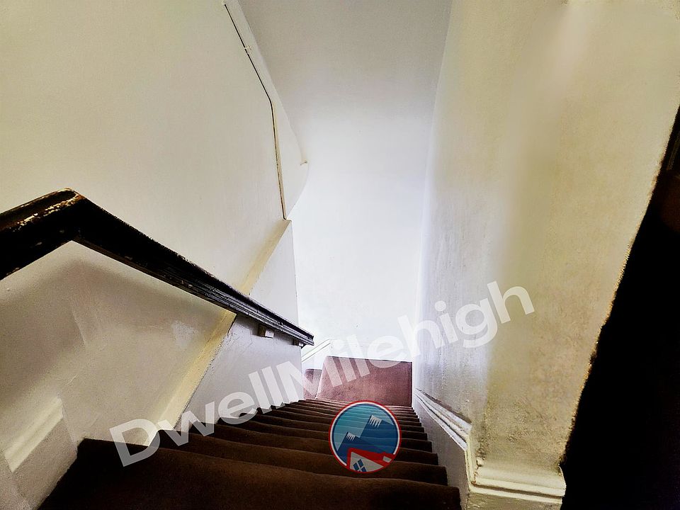 Stairs from the front door to hallway