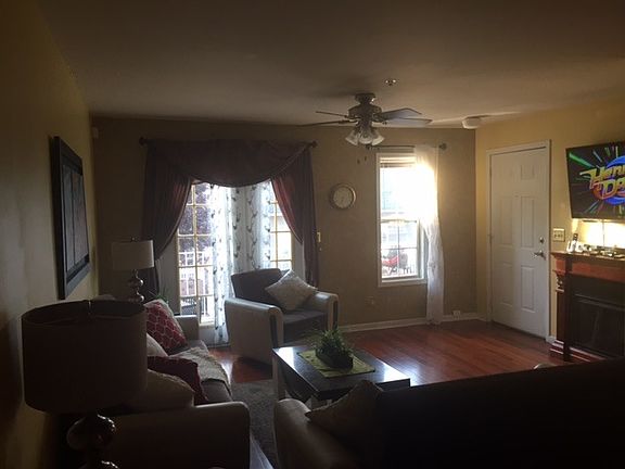 Living area, door leading to front deck