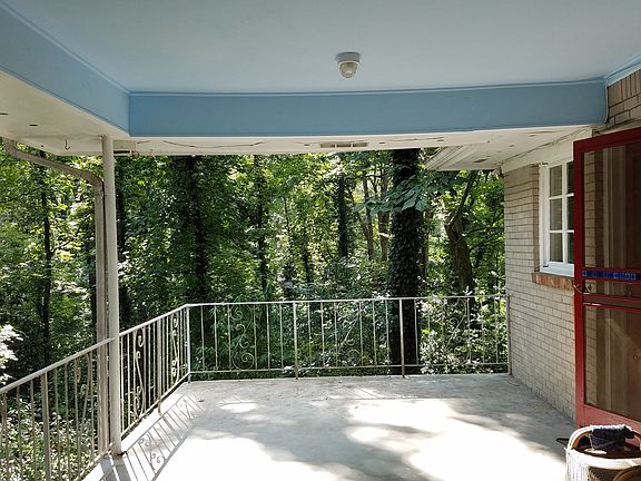 large covered porch overlook woods