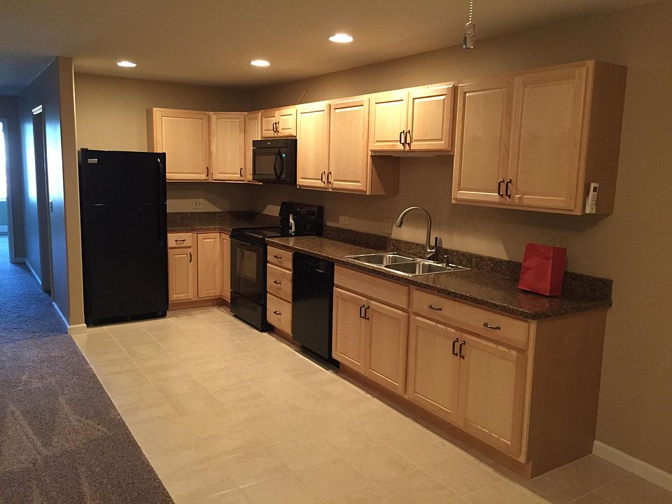 This is the kitchen combined with the living room. There is a built in microwave, dishwasher, disposable, electric stove and refrigerator with ice maker.