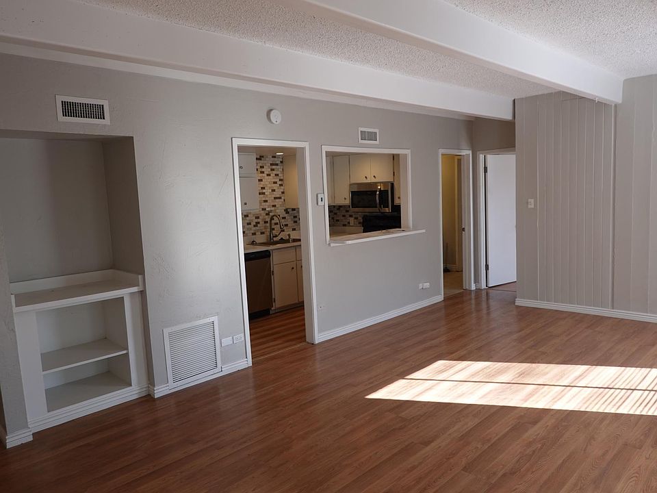 Living room and kitchen . Lots of natural light
