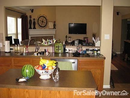 Kitchen
						:
						Kitchen with island looking into living room