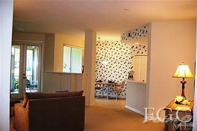 GREAT ROOM, FRESHLY PAINTED! INTERIOR DECORATOR DESIGN! CUSTOM CABINETS. FRENCH DOORS ONTO LANAI.