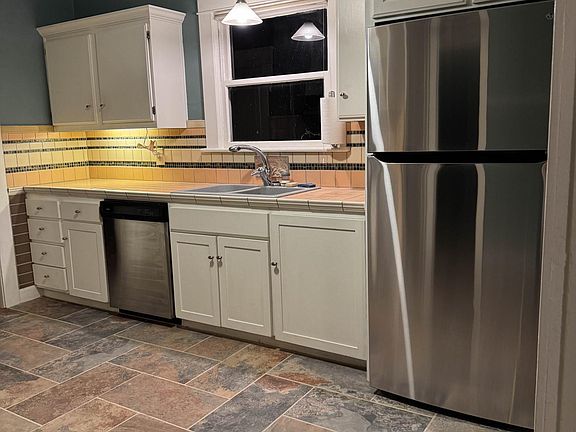 Kitchen with new stainless steel fridge