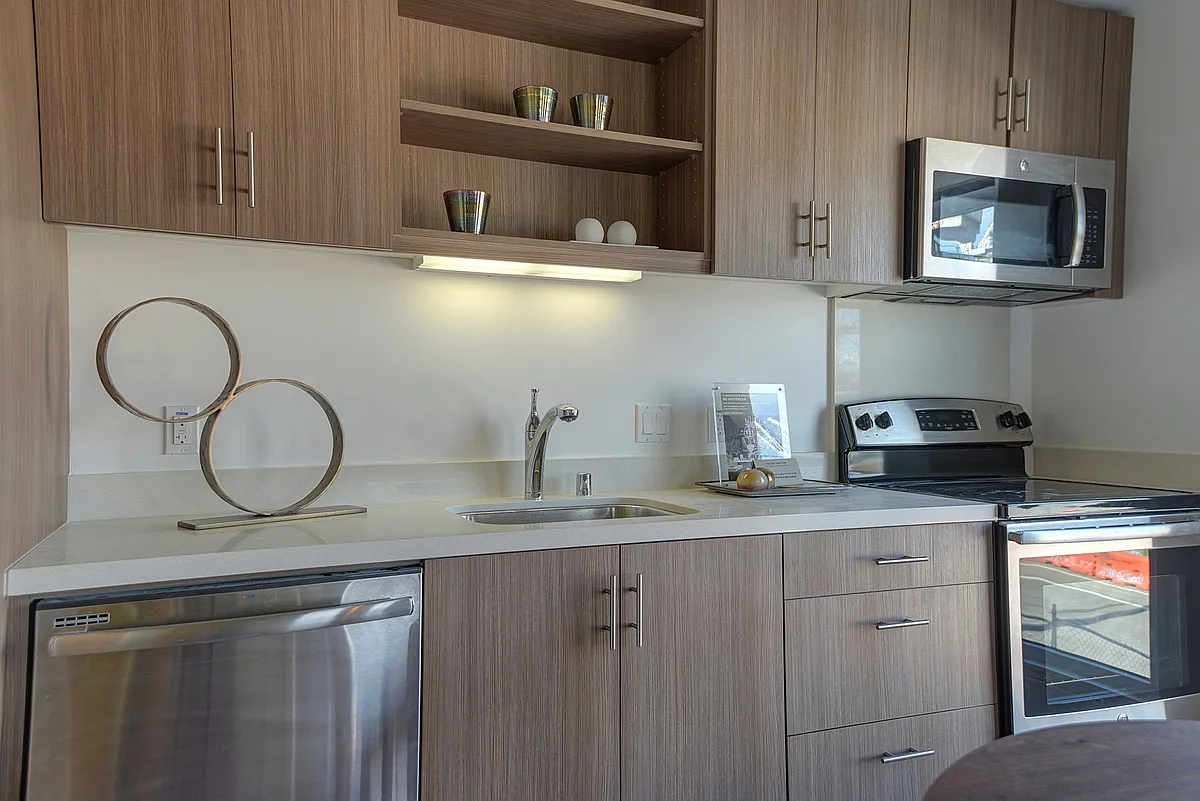 Stylish kitchen with stainless steel appliances and quartz countertops - The Gantry