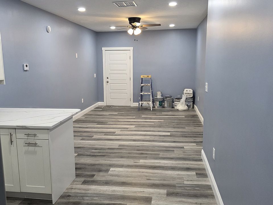 Living Area and Entry Door Taken from Kitchen