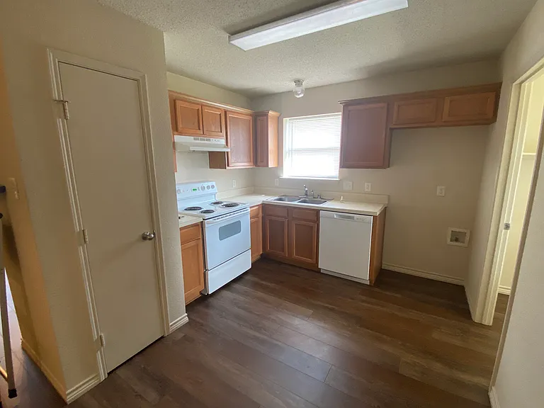 Kitchen with Pantry, Stove, Vent Hood, Dishwasher and Garbage Disposal
