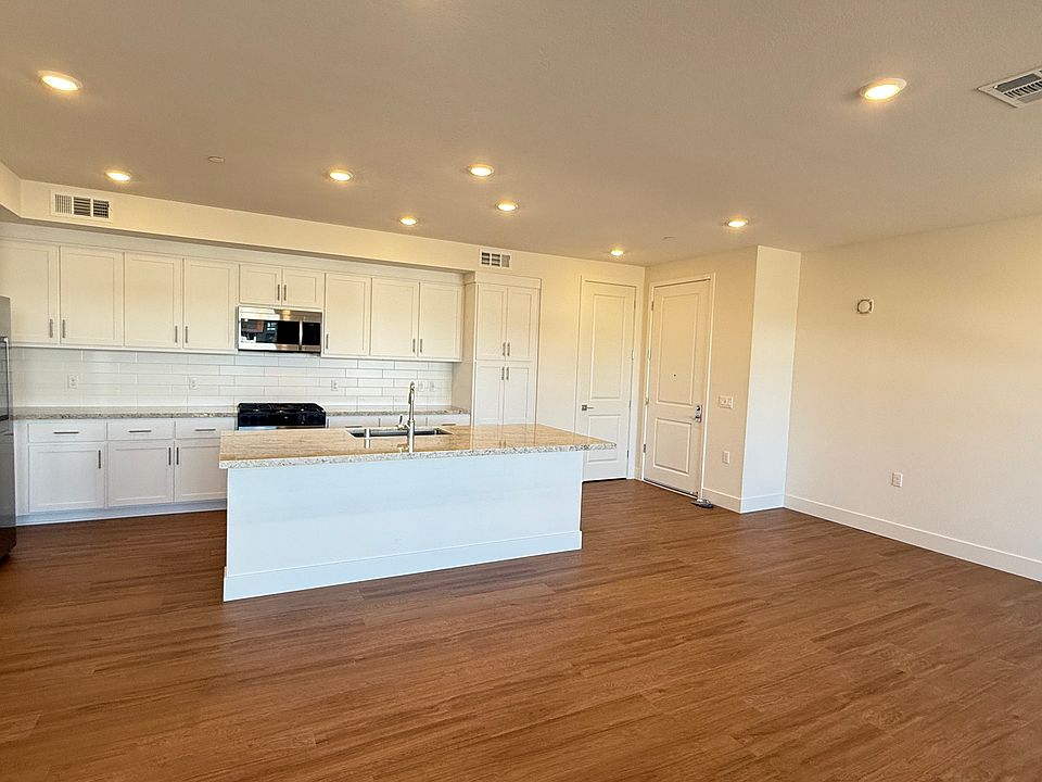 Full view of Kitchen, Living room + Family room