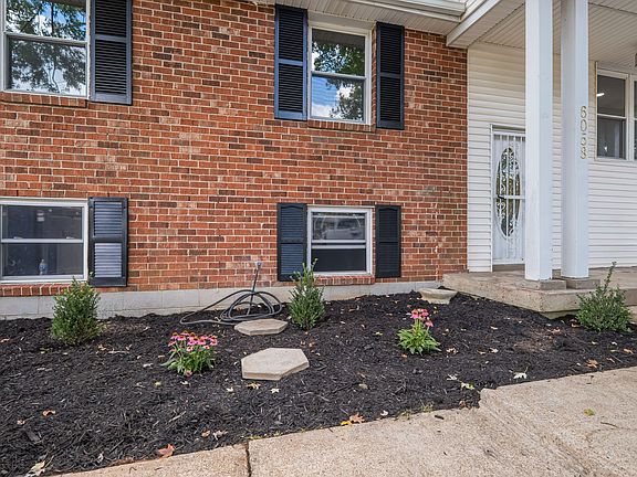 Brick home, with front porch.