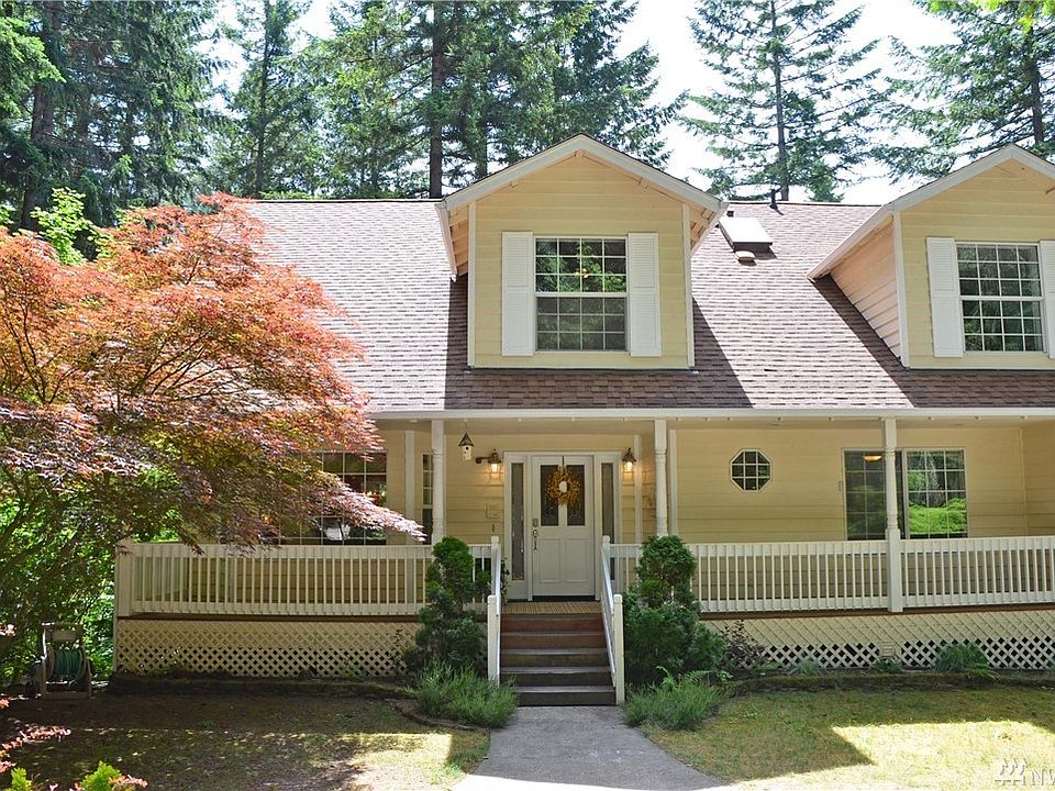 Charming covered front Porch adjacent off 1/2 moon circular driveway.