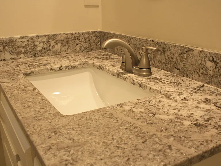 Beautiful granite vanity top in hall bath