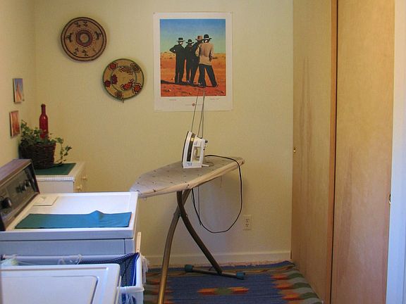 LAUNDRY OFF KITCH FEATURES AN 8'X8' PANTRY CLOSET