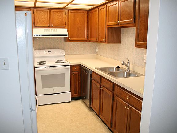 Kitchen with new stove, newer refrigerator and dishwasher