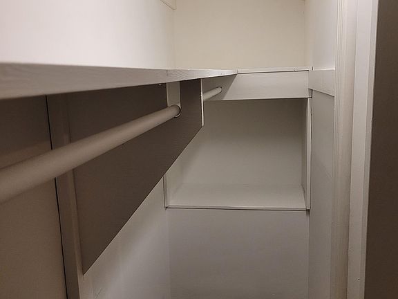Bedroom #1 built-in shelves in closet.