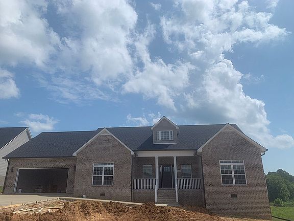 Front with concrete driveway