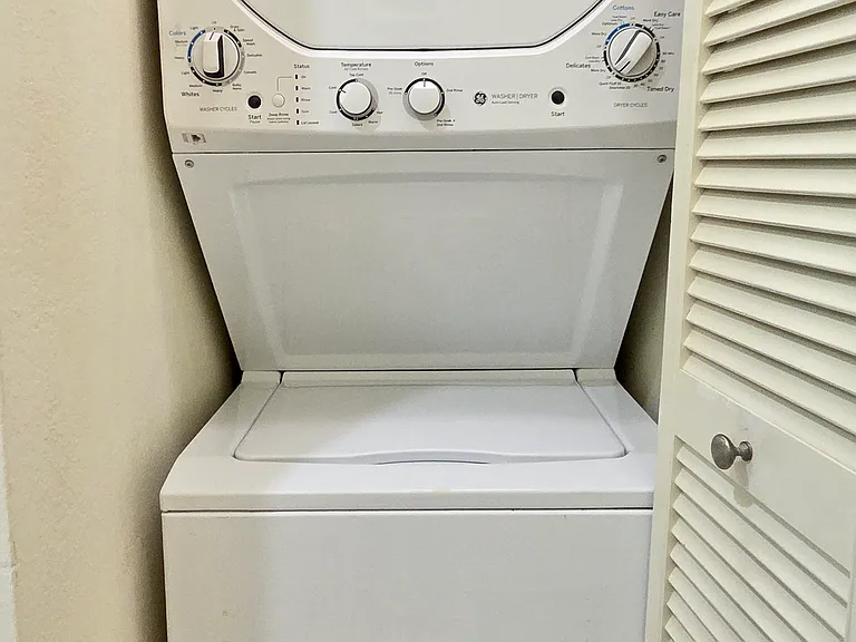 Washer and Dryer Stacked Set In Unit