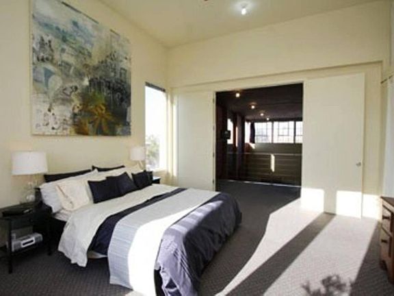 Sunny Master Bedroom on top floor. French doors that open up