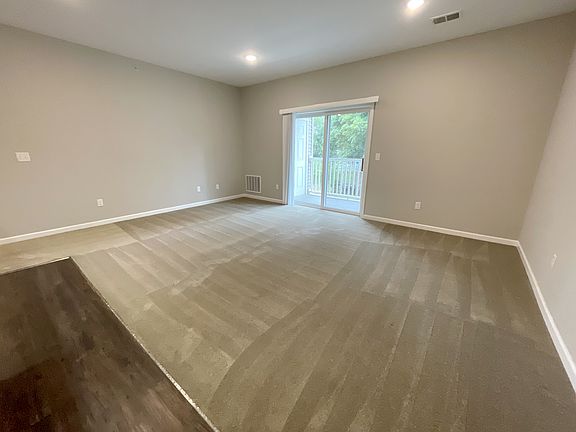 Living Room w. Sliding Glass Door to Balcony
