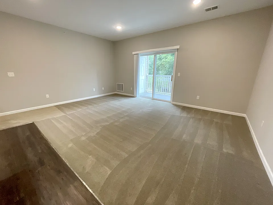 Living Room w. Sliding Glass Door to Balcony