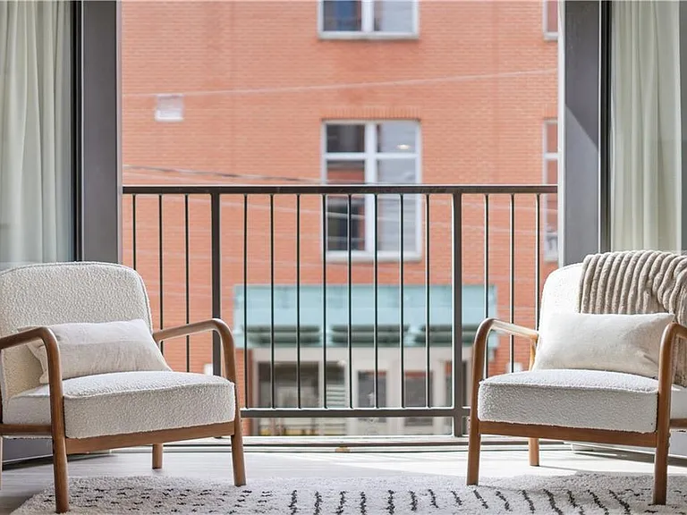Juliette balcony that opens to street