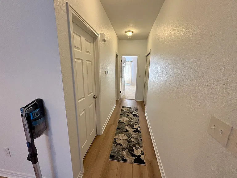 Hallway leading to Second Bathroom and Primary Bedroom