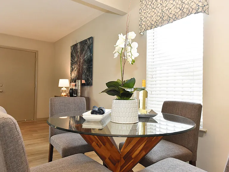 Dining area with hardwood-style flooring