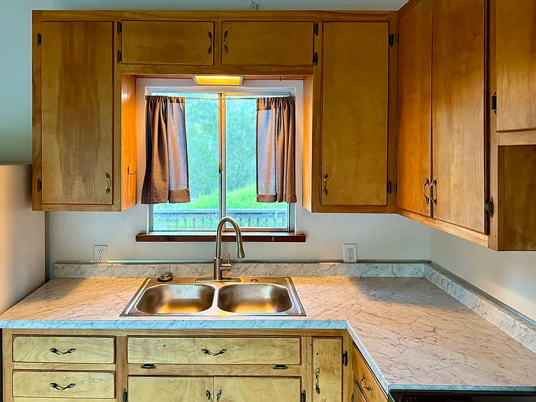 Kitchen, overlooking front redwood deck, canyon, oaks and hills