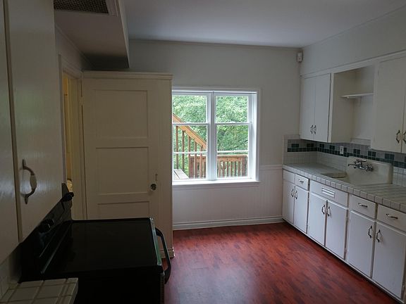 Large charming white tile kitchen