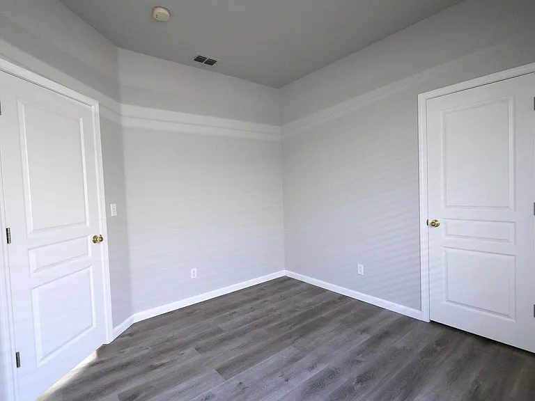 Bedroom #2 with recessed lightning, window blinds, and closet