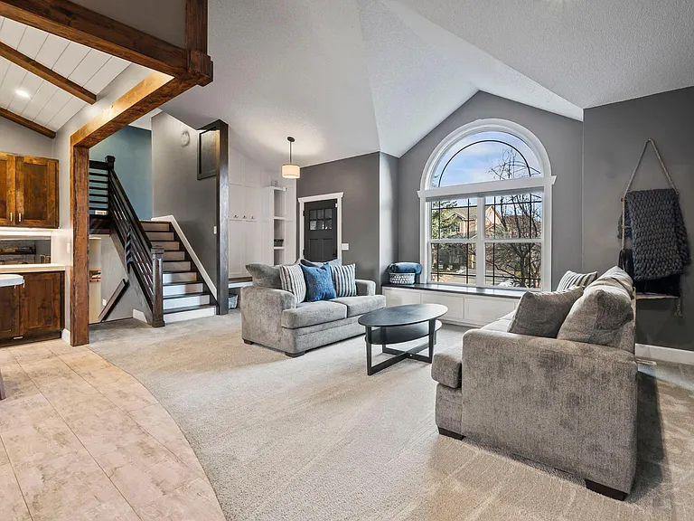 Open concept layout, where the kitchen island seamlessly connects to the welcoming living room.