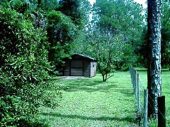 Storage shed in back.