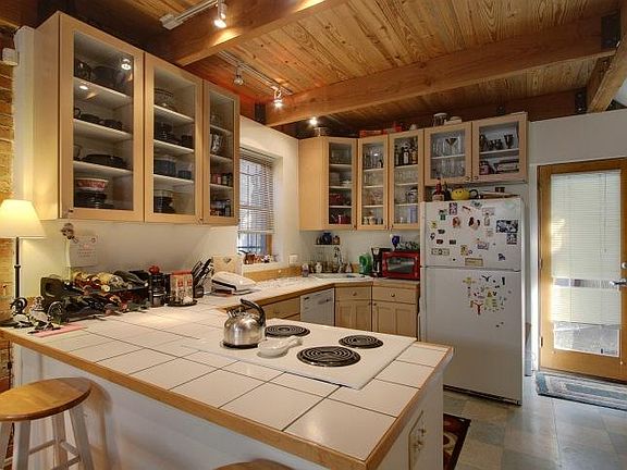 Open kitchen + bar countertop seats up to 4