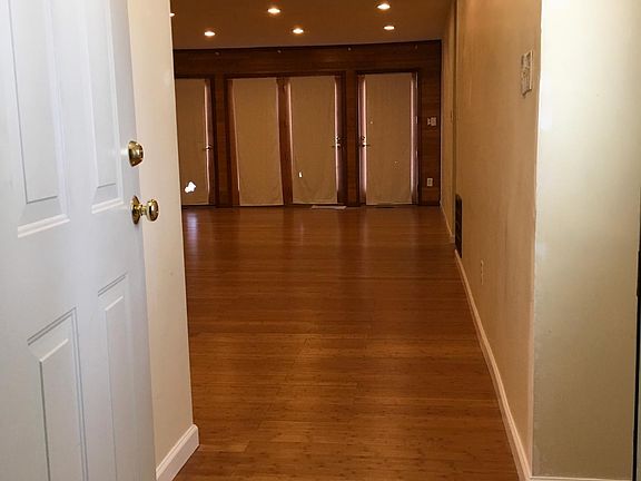 (Standing in door frame of interior door to Big room)Looking north towards door to deck; entry door is on right