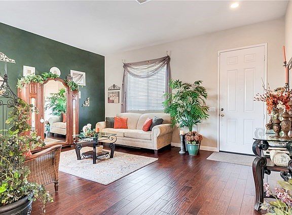 High Ceilings and Gorgeous Distressed-Look Hardwood Floors