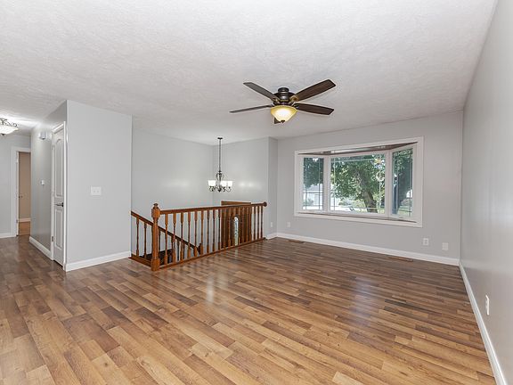 Upper level living room with excellent natural light.