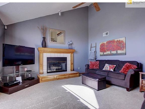 Light filled great room with gas fireplace.