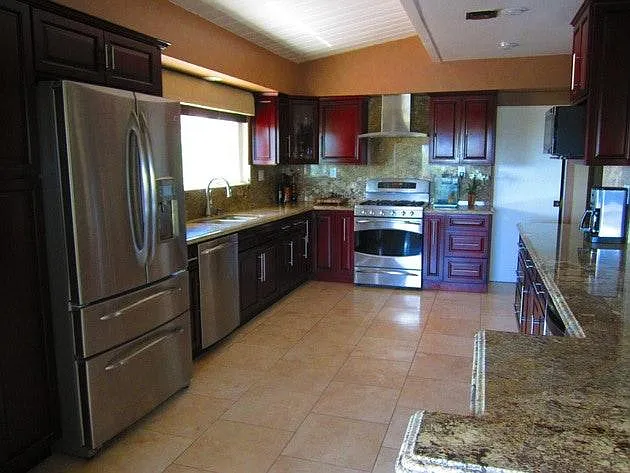Large open kitchen with stainless appliances.